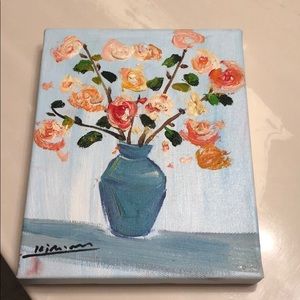 Signed painting of flowers in a vase